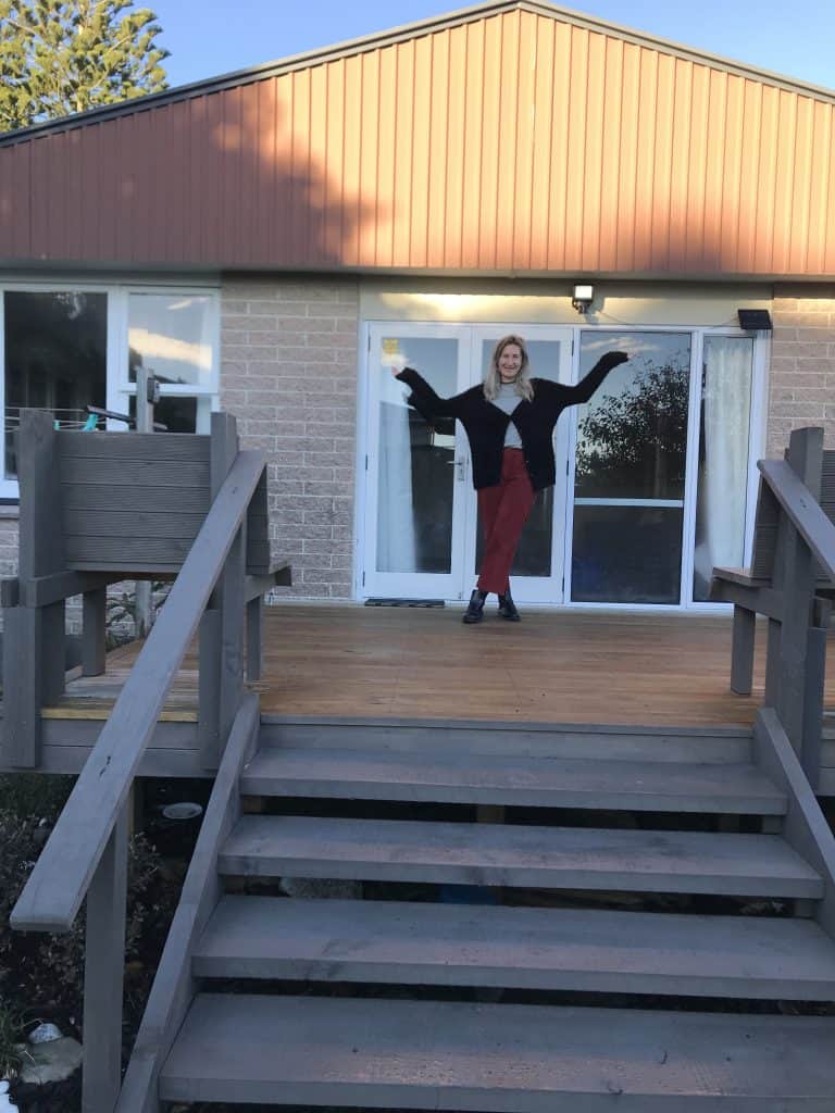 a photo of me outside my favourite airbnb accommodation option in the west coast south island 