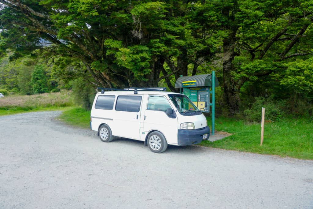 A photo of my campervan during my South Island road trip. A great example of the beautiful destinations you can see while van living full time in NZ. 