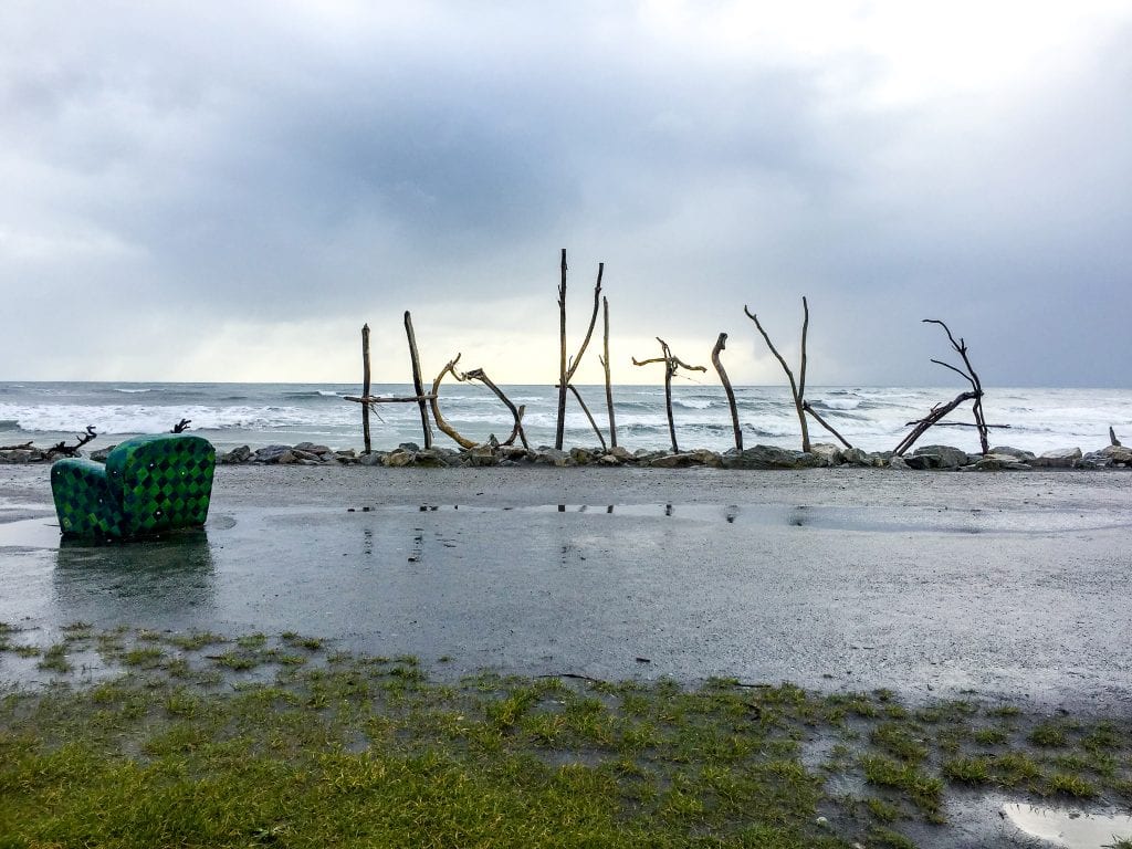 Hokitika beach is one of the best things to do in the west coast and this is a photo of the iconic drift wood sign