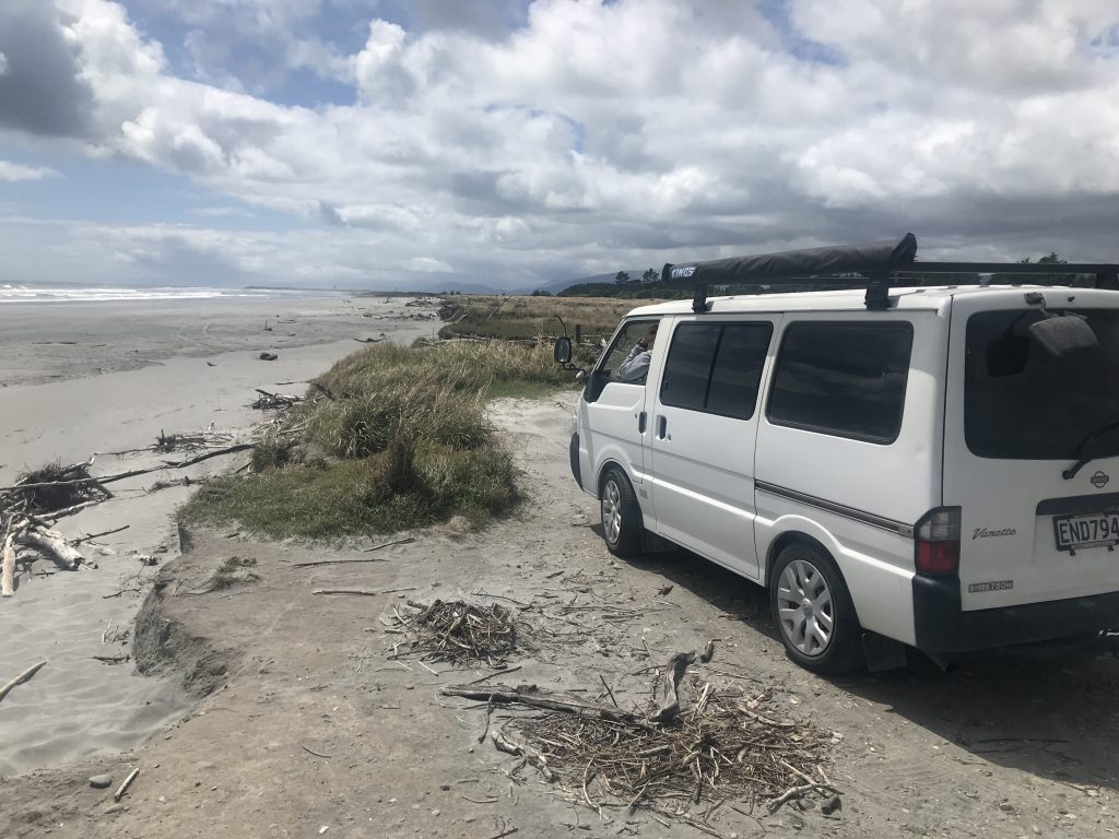 A photo of my campervan on a west coast south island beach
