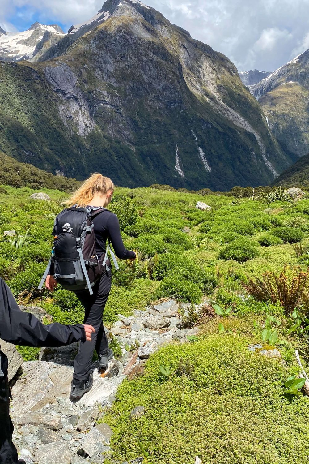 two girls hiking the milford track in the southland region